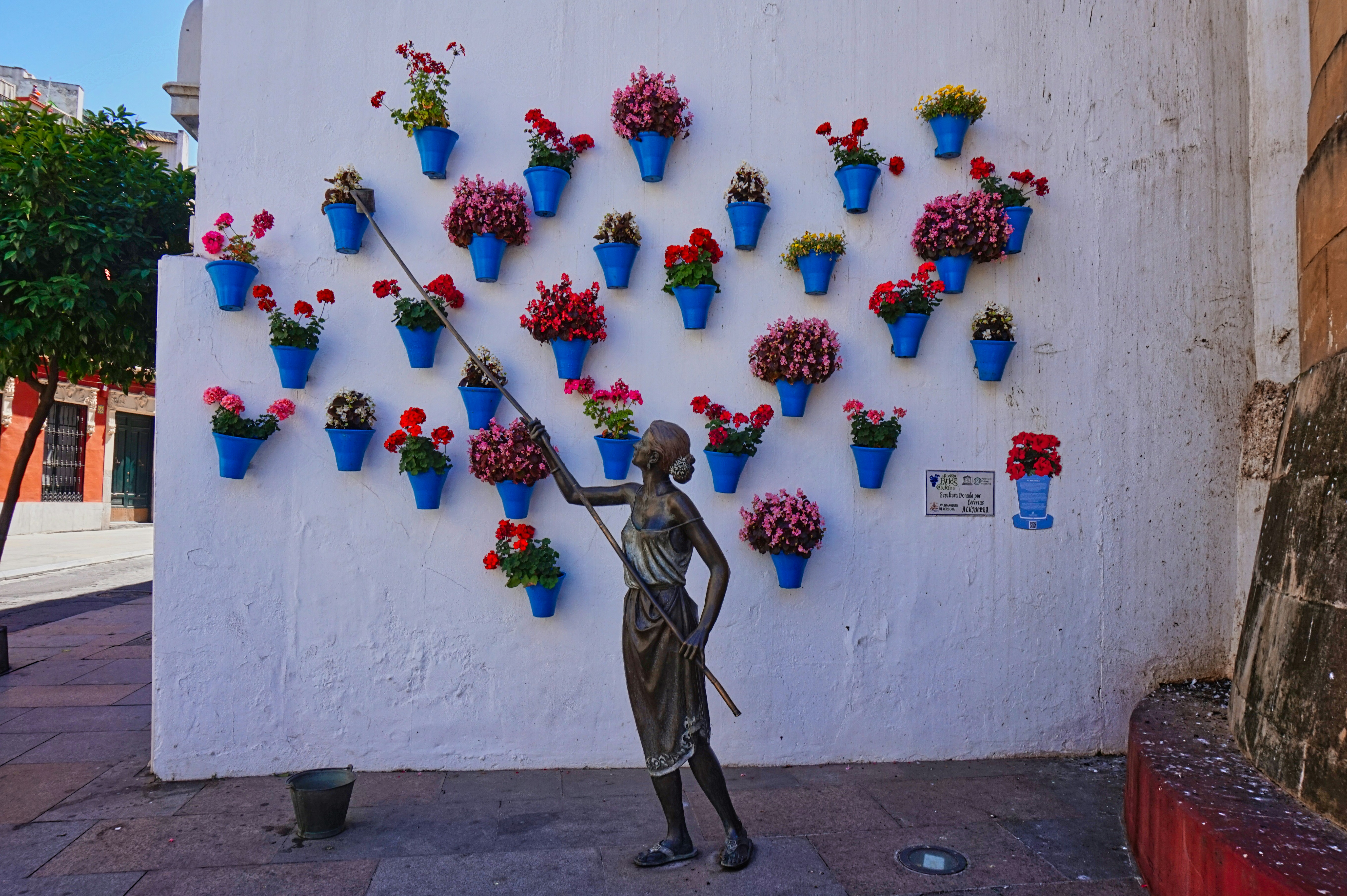 White wall decorated with flower pots in Estepona